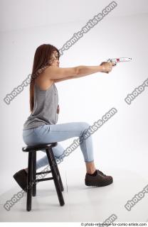13 2020 MOLLY SITTING POSE WITH GUN